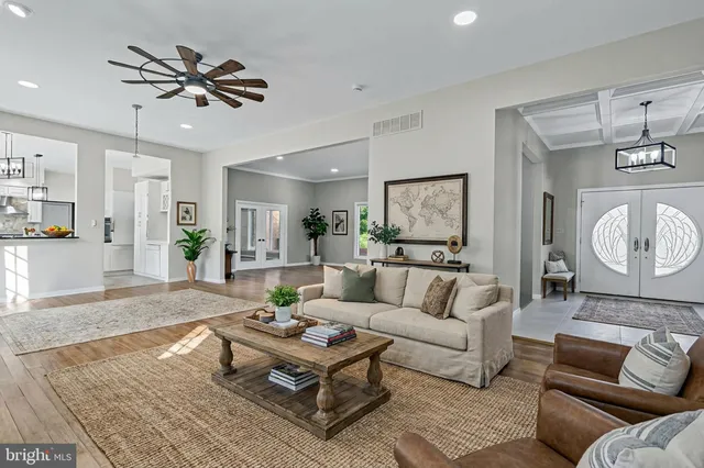 a kitchen with stainless steel appliances granite countertop a stove and white cabinets