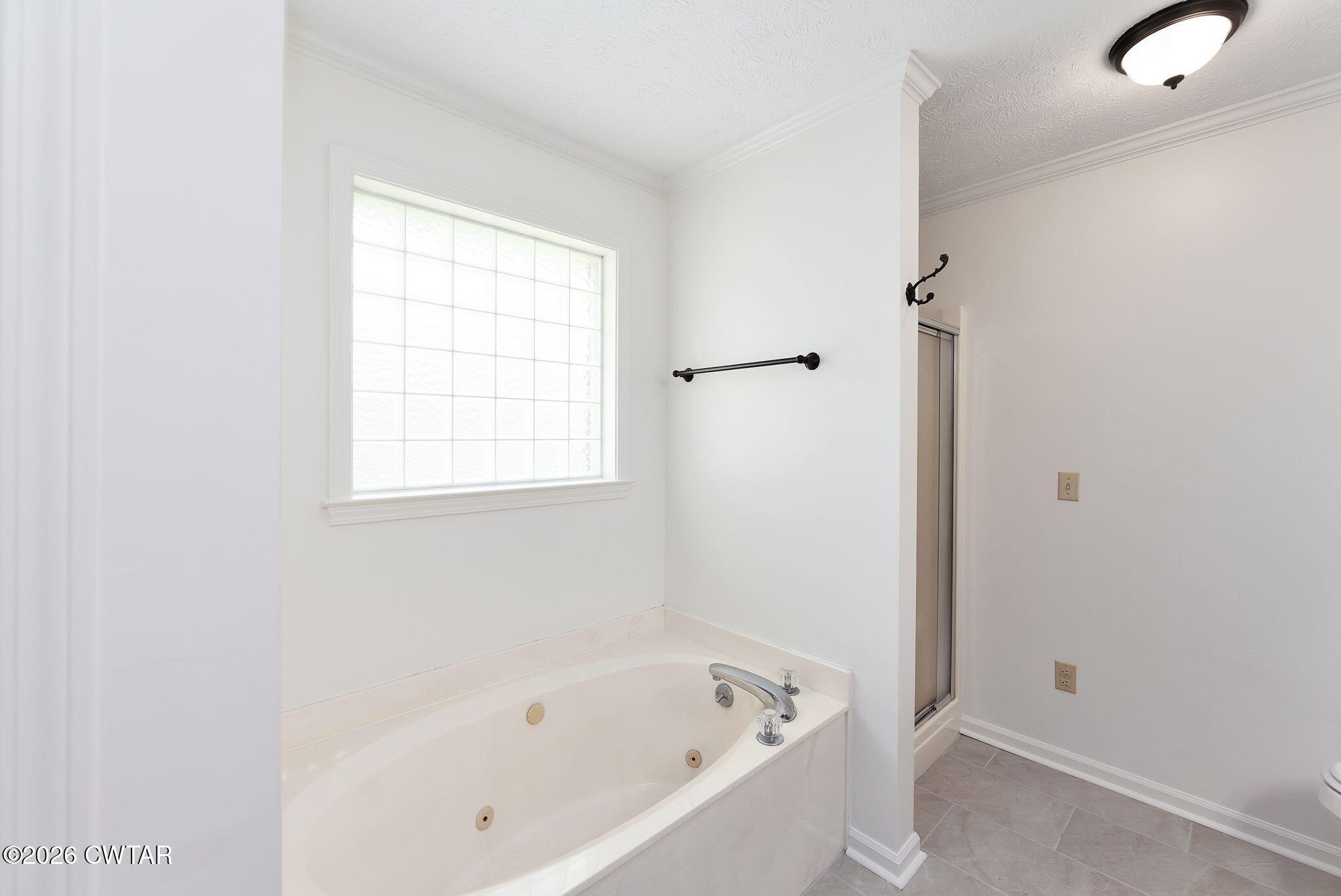 96 Sundown Drive Jackson, TN 38305 - Photo 17 of 28 a white bath tub sitting next to a window