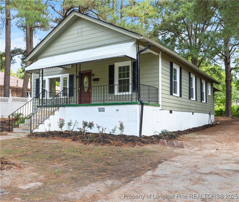 726 West M Street Erwin, NC 28339 - Photo 1 of 24 a front view of a house with a yard