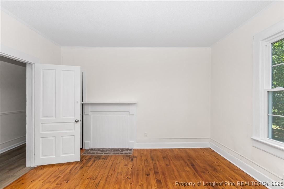 726 West M Street Erwin, NC 28339 - Photo 12 of 24 a view of a room with wooden floor