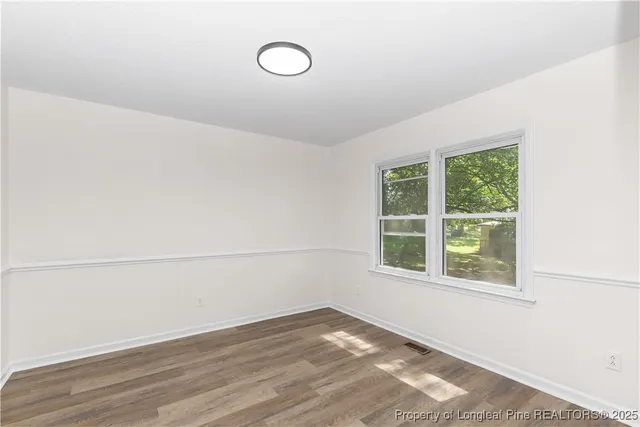 a view of a room that has a window in it