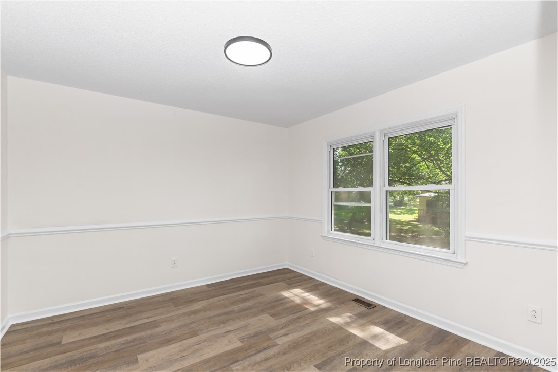 726 West M Street Erwin, NC 28339 - Photo 16 of 24 a view of a room that has a window in it