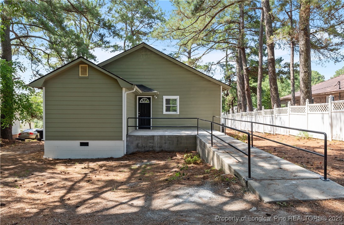 726 West M Street Erwin, NC 28339 - Photo 19 of 24 a view of a small house with a yard