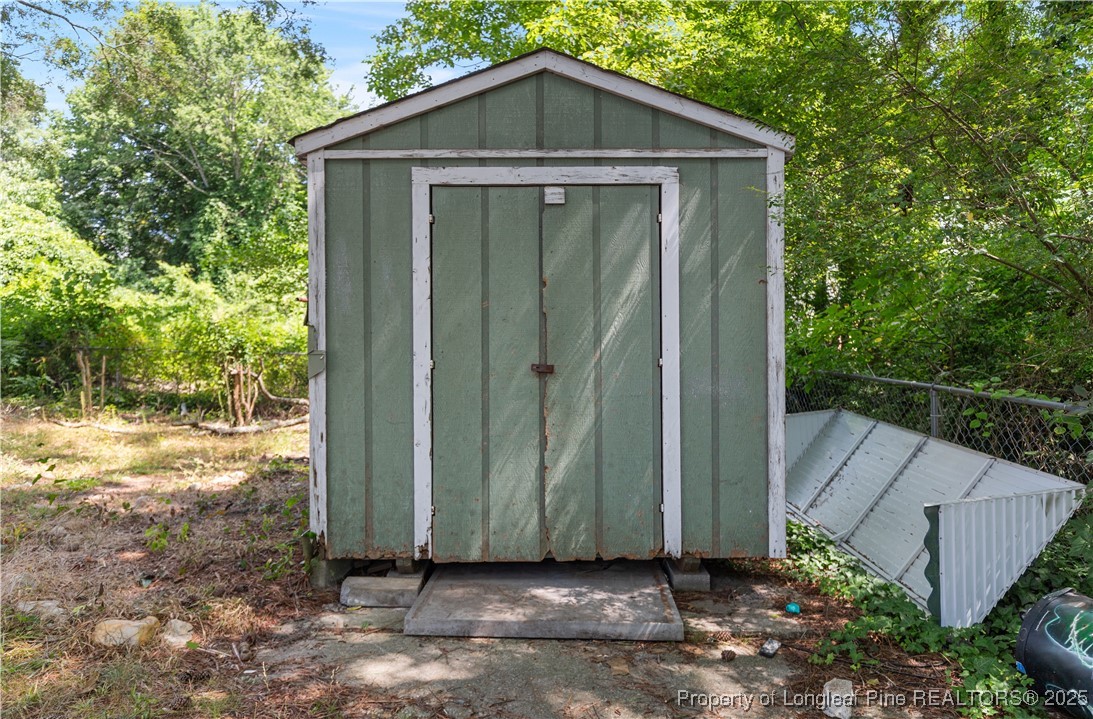 726 West M Street Erwin, NC 28339 - Photo 21 of 24 a wooden door in front of a house