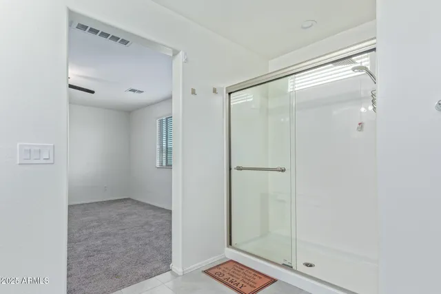 a bathroom with a double vanity sink mirror and double