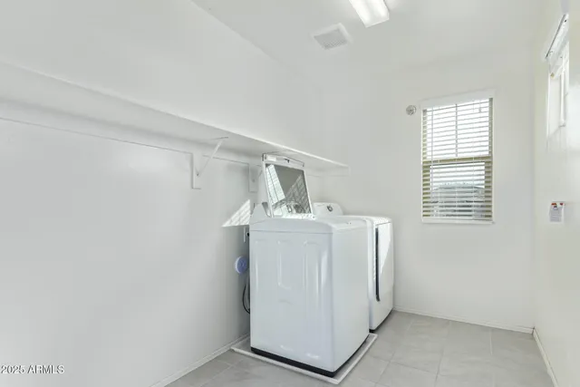 a view of a room with a ceiling fan and a window