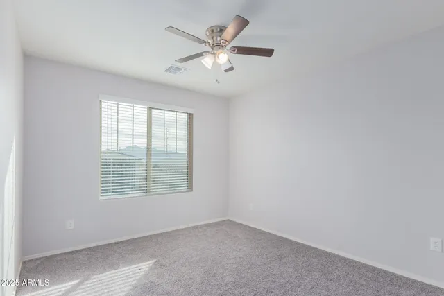 a bathroom with a shower a toilet and a sink