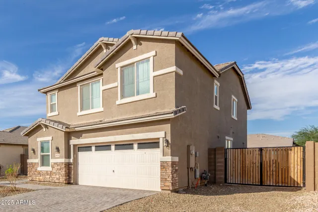 a front view of a house with a garage