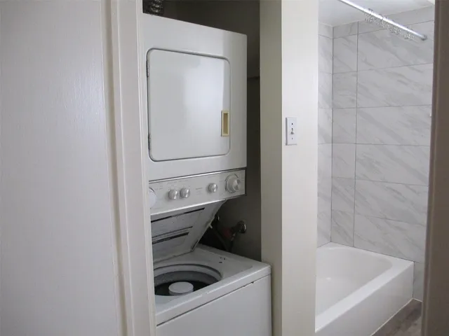 a bathroom with a bathtub sink and toilet