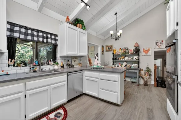 a kitchen with a sink and cabinets