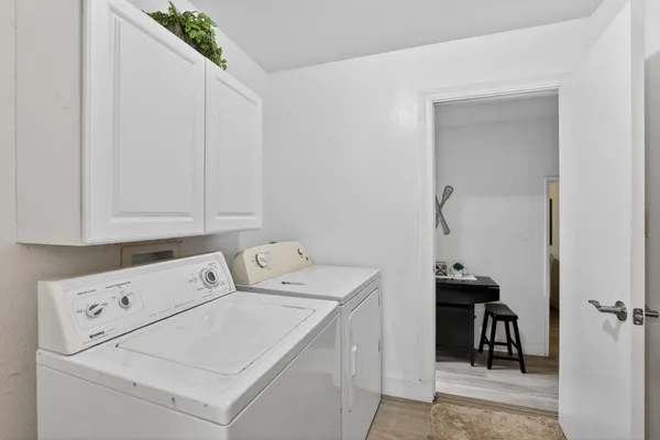 a living room with furniture and a mirror