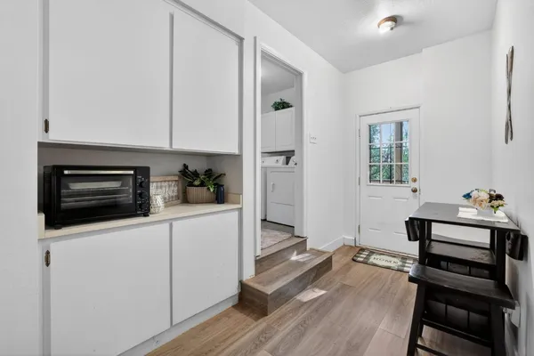 a bathroom with a granite countertop toilet sink and mirror