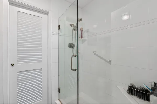 a view of balcony with wooden floor and fence