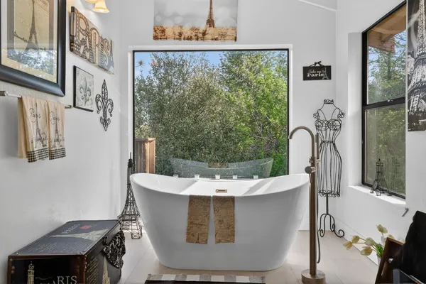 a view of a chairs and table on the wooden deck