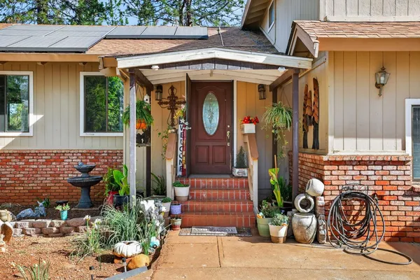 a living room with furniture rug and window