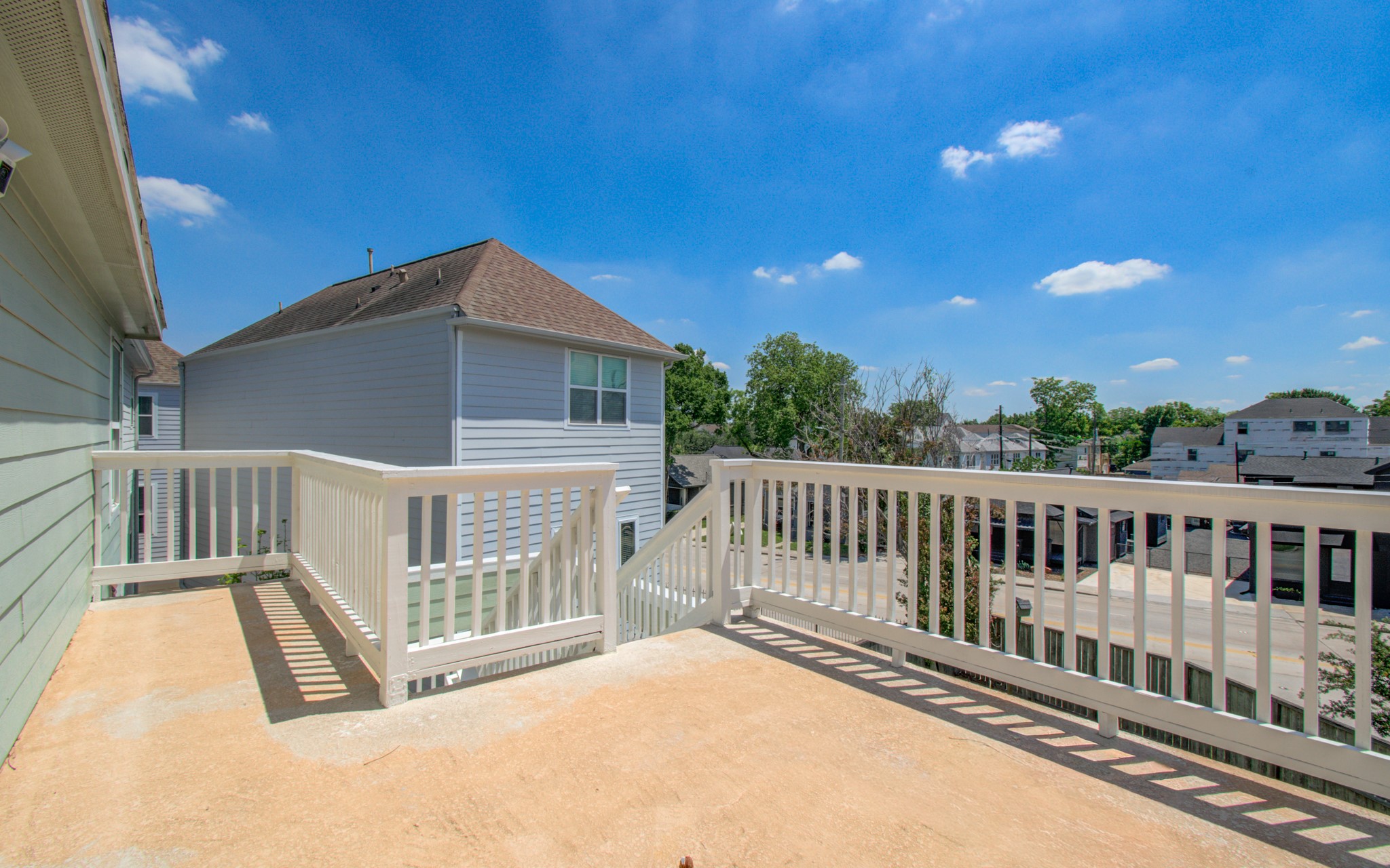 6621 North Main Street Houston, TX 77009 - Photo 23 of 41 Easy access to your yard, the outdoor balcony offers stunning neighborhood views, perfect for relaxing or entertaining.