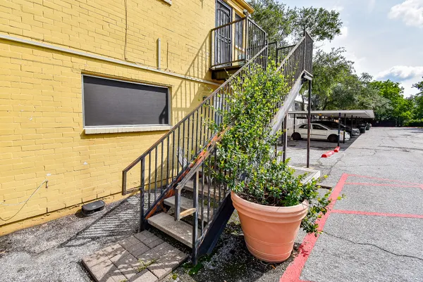 a view of a chair and table in the balcony