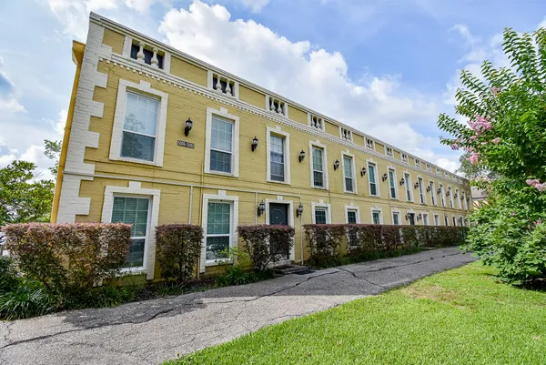 a front view of a building with garden