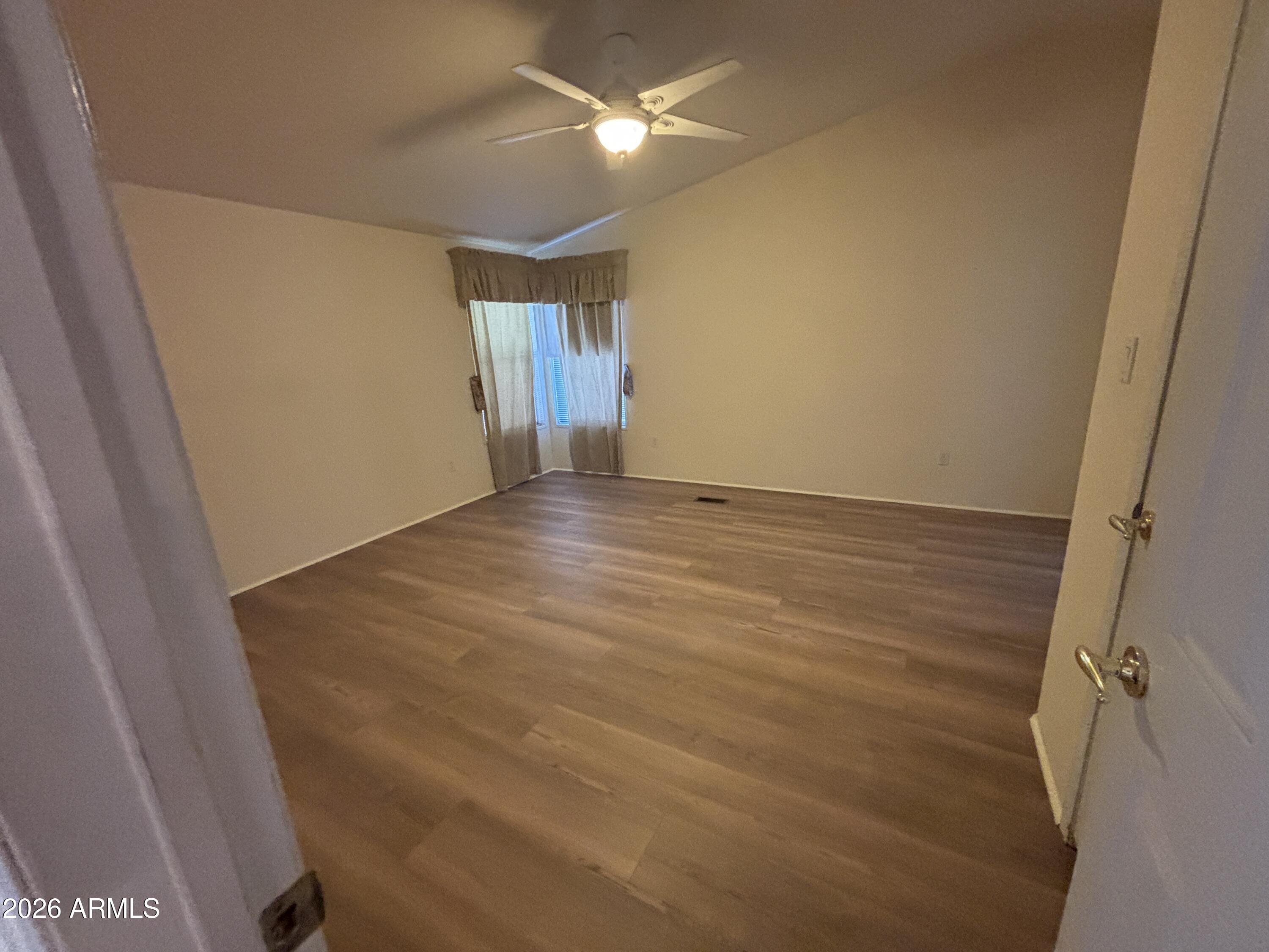 3355 South Cortez Road, Unit 28 Apache Junction, AZ 85119 - Photo 11 of 24 a view of an empty room with closet and a window