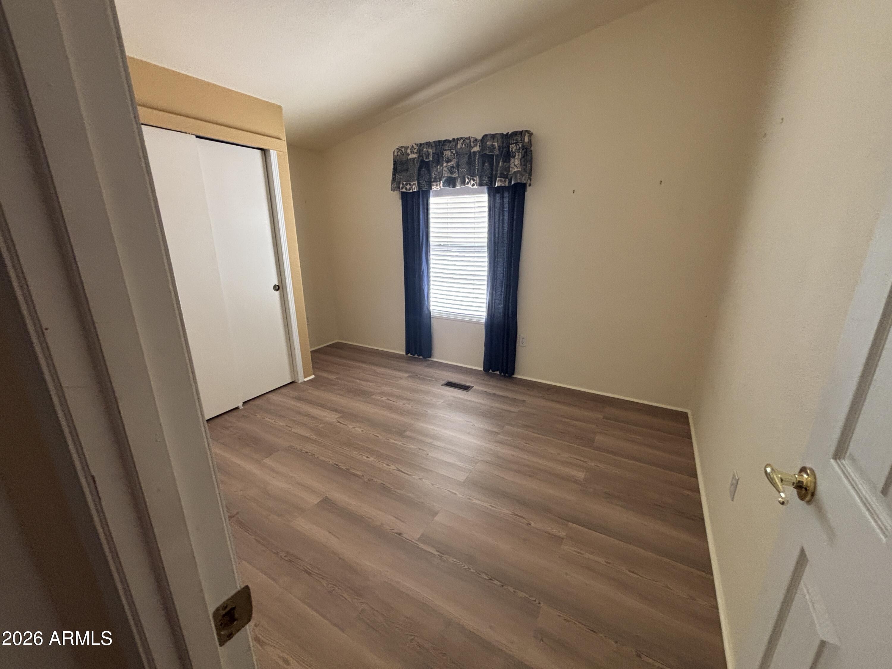 3355 South Cortez Road, Unit 28 Apache Junction, AZ 85119 - Photo 18 of 24 a view of an empty room with a window