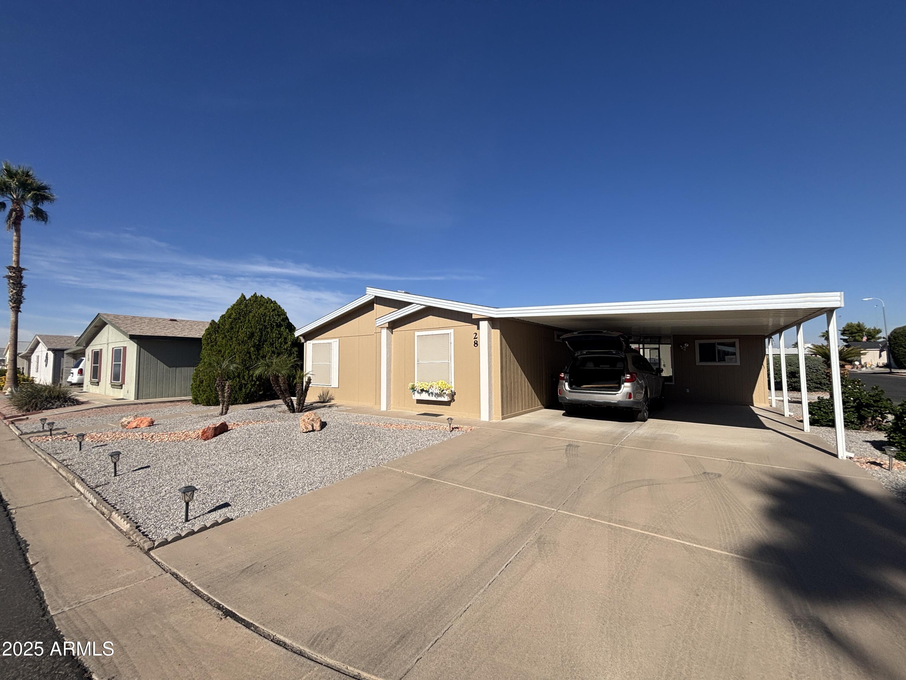 3355 South Cortez Road, Unit 28 Apache Junction, AZ 85119 - Photo 3 of 24 a view of a house with roof yard
