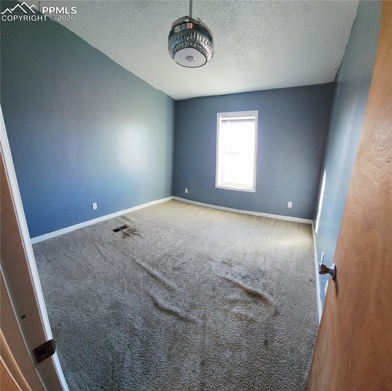 6760 Yoder Road Yoder, CO 80864 - Photo 14 of 23 a view of empty room with window