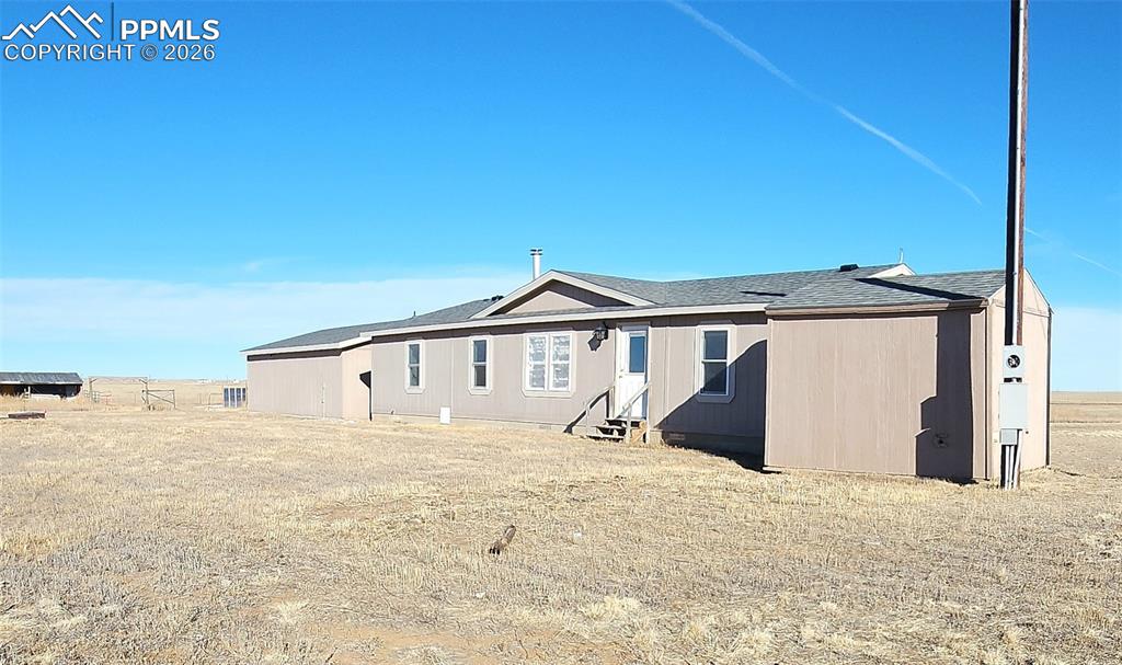 6760 Yoder Road Yoder, CO 80864 - Photo 3 of 23 a view of a house with a big yard