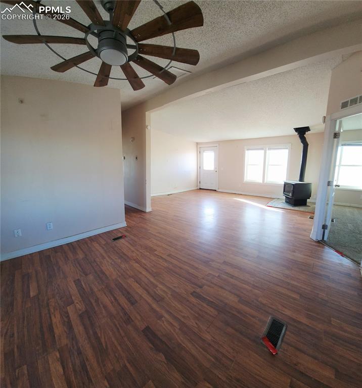 6760 Yoder Road Yoder, CO 80864 - Photo 9 of 23 a view of empty room with wooden floor