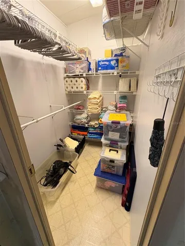 a bedroom with a bed and flat screen tv