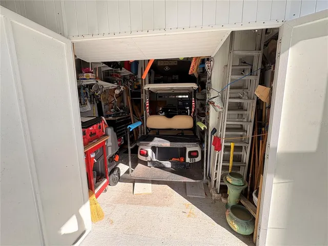 a view of a chairs and tables in a room