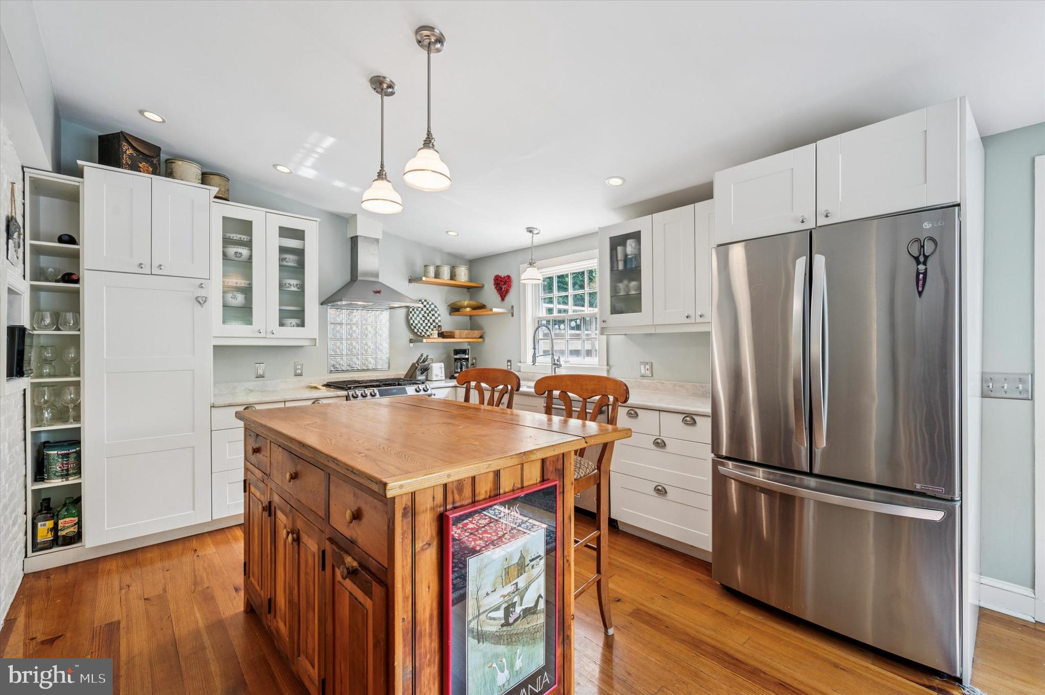 119 Francis Avenue Wayne, PA 19087 - Photo 13 of 26 a kitchen with stainless steel appliances a stove a refrigerator and a refrigerator