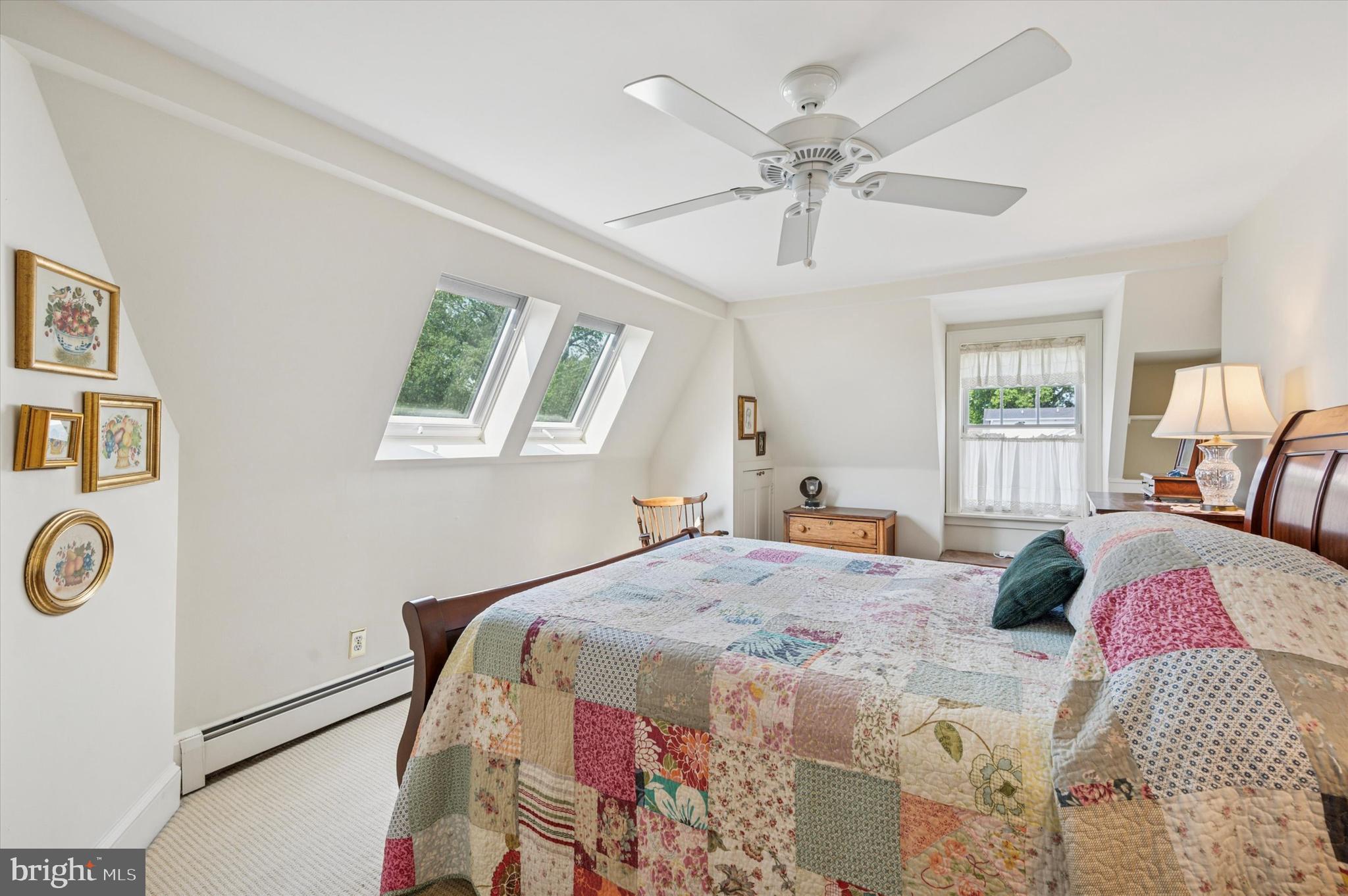 119 Francis Avenue Wayne, PA 19087 - Photo 21 of 26 a bedroom with a bed and a chandelier