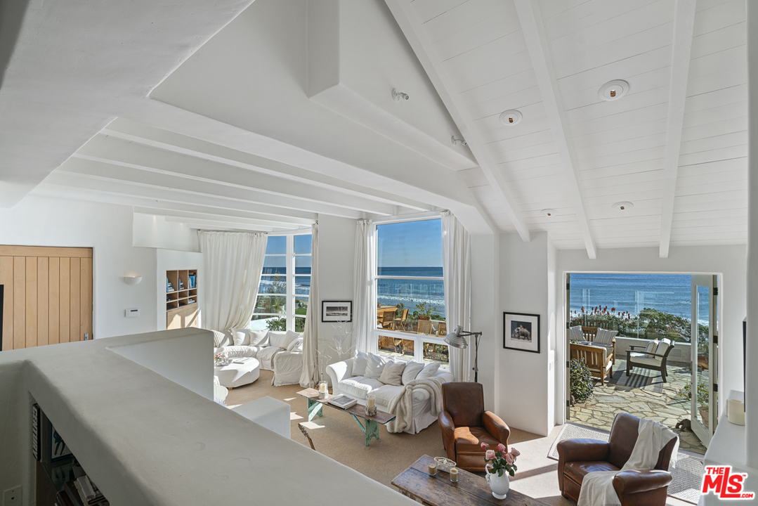 31725 Sea Level Drive Malibu, CA 90265 - Photo 13 of 37 a view of a livingroom with furniture and floor to ceiling window