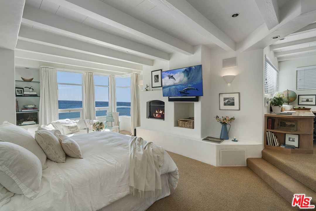 31725 Sea Level Drive Malibu, CA 90265 - Photo 17 of 37 a spacious bedroom with a bed and a couch
