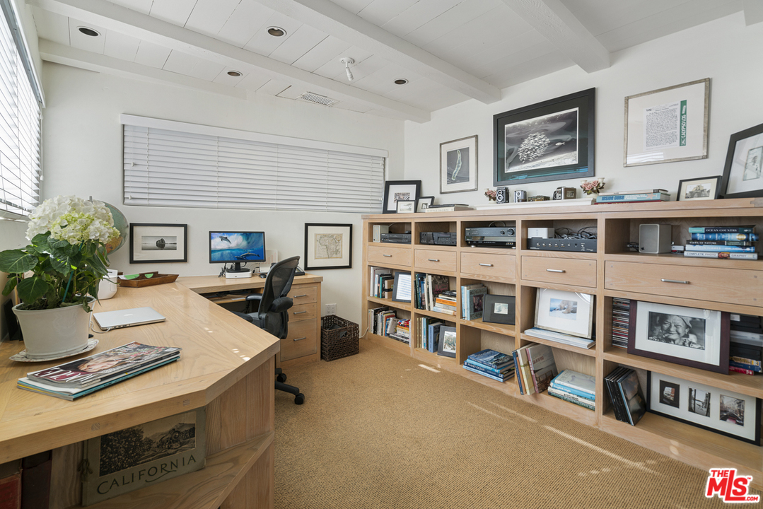 31725 Sea Level Drive Malibu, CA 90265 - Photo 20 of 37 a living room with furniture and a book shelf
