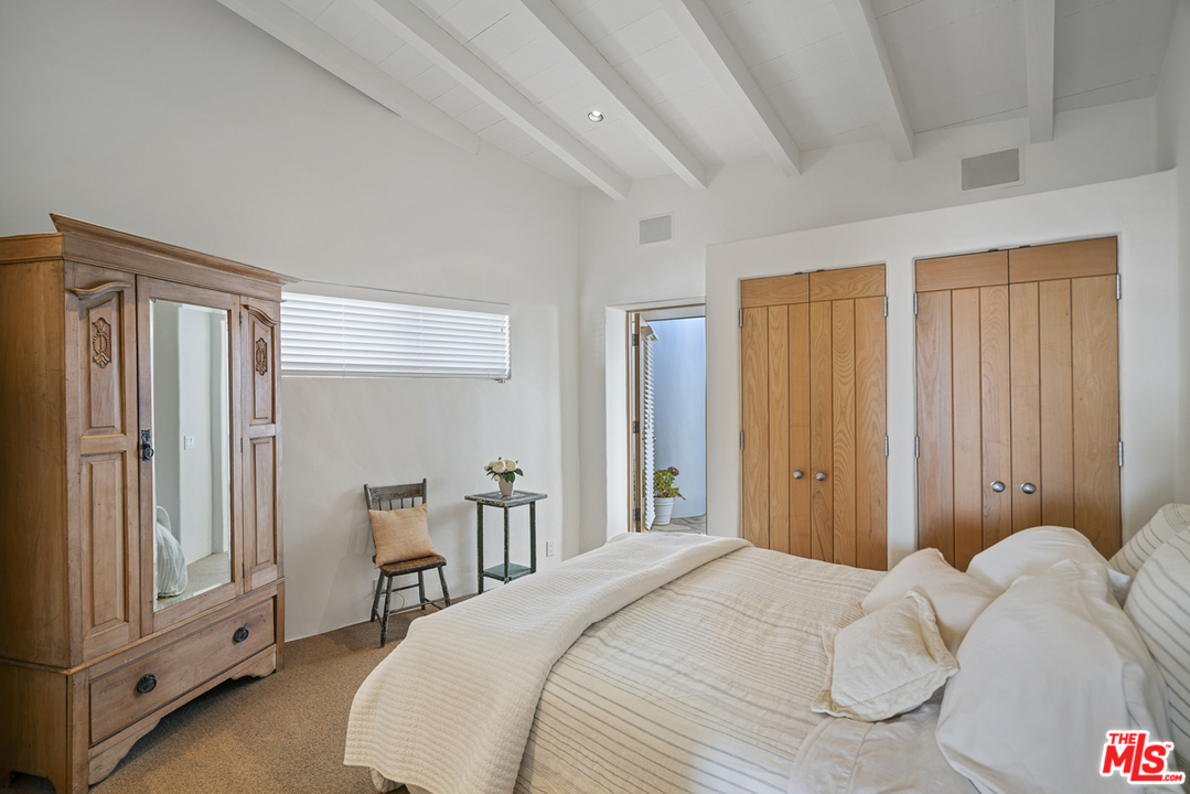 31725 Sea Level Drive Malibu, CA 90265 - Photo 24 of 37 a bedroom with a bed and a window