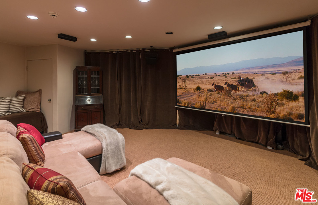 31725 Sea Level Drive Malibu, CA 90265 - Photo 25 of 37 a bedroom with a bed and a large window