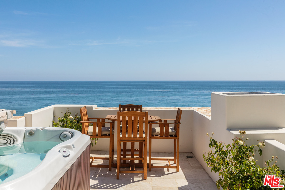 31725 Sea Level Drive Malibu, CA 90265 - Photo 27 of 37 a terrace with outdoor seating and city view