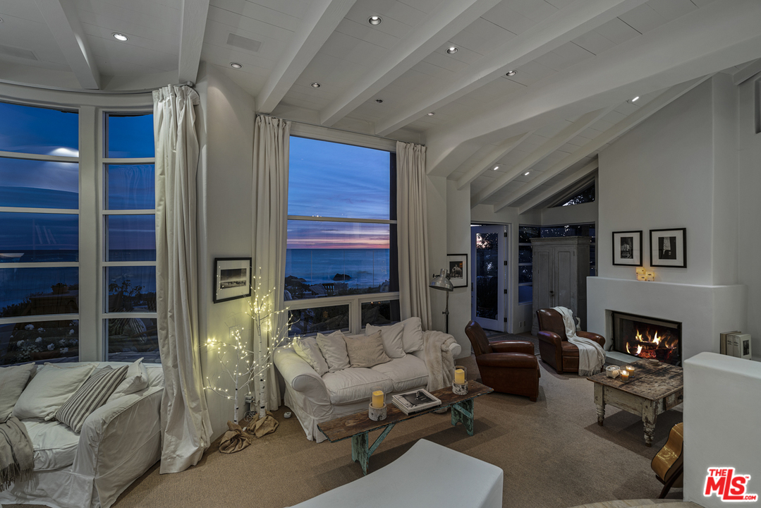 31725 Sea Level Drive Malibu, CA 90265 - Photo 33 of 37 a living room with furniture a fireplace and a flat screen tv
