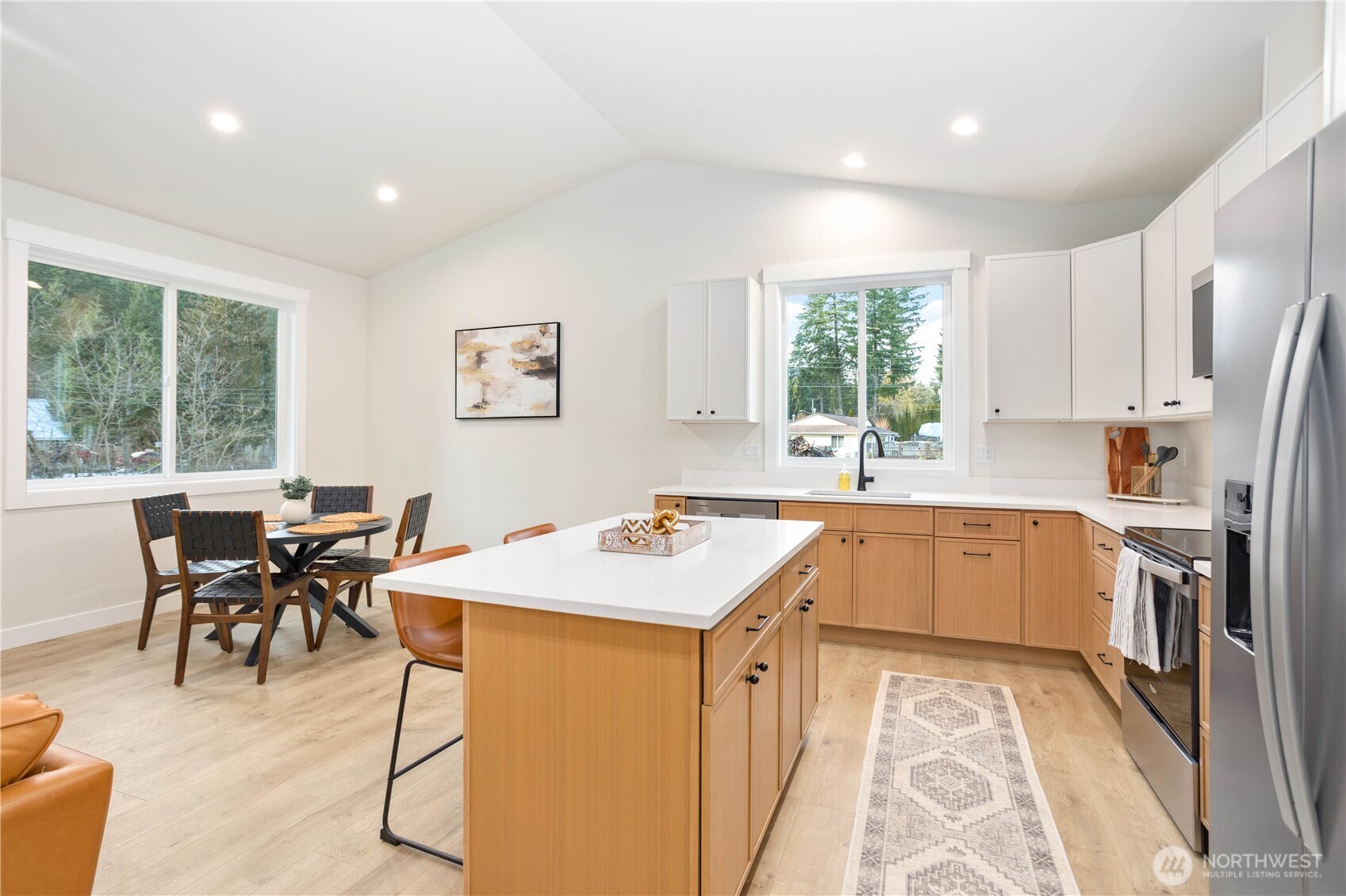 7933 Oregon Trail Maple Falls, WA 98266 - Photo 12 of 29 a kitchen with a table chairs sink and cabinets