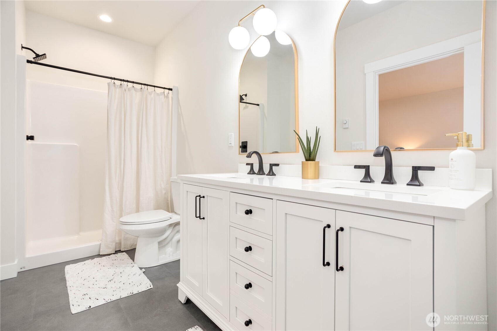 7933 Oregon Trail Maple Falls, WA 98266 - Photo 21 of 29 a bathroom with a double vanity sink mirror and toilet