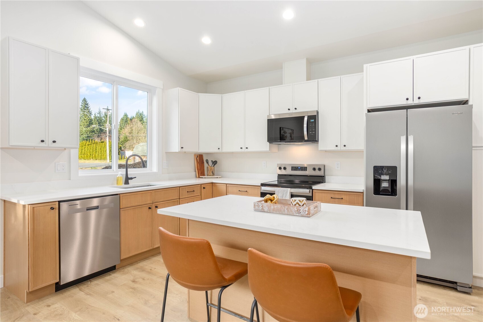 7933 Oregon Trail Maple Falls, WA 98266 - Photo 8 of 29 a kitchen with stainless steel appliances a stove a sink a microwave a refrigerator and white cabinets