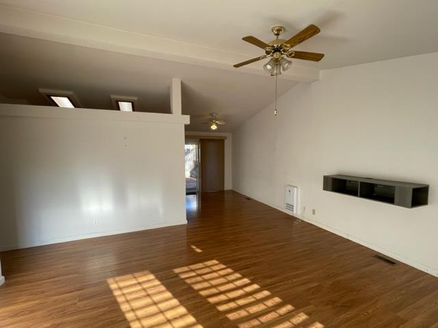 166 Oak Tree Circle Murphys, CA 95247 - Photo 2 of 21 a view of a livingroom with a ceiling fan and wooden floor