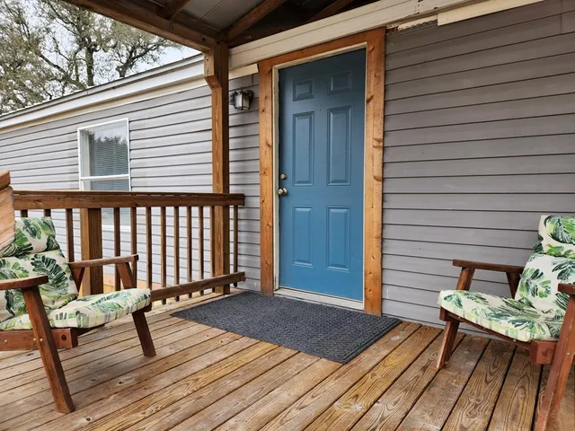 a view of a kitchen with a sink and a window