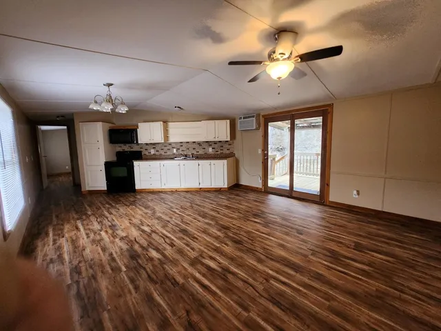 a view of a livingroom with wooden floor