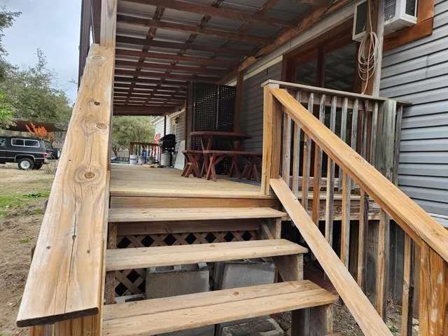 a view of a patio with wooden floor
