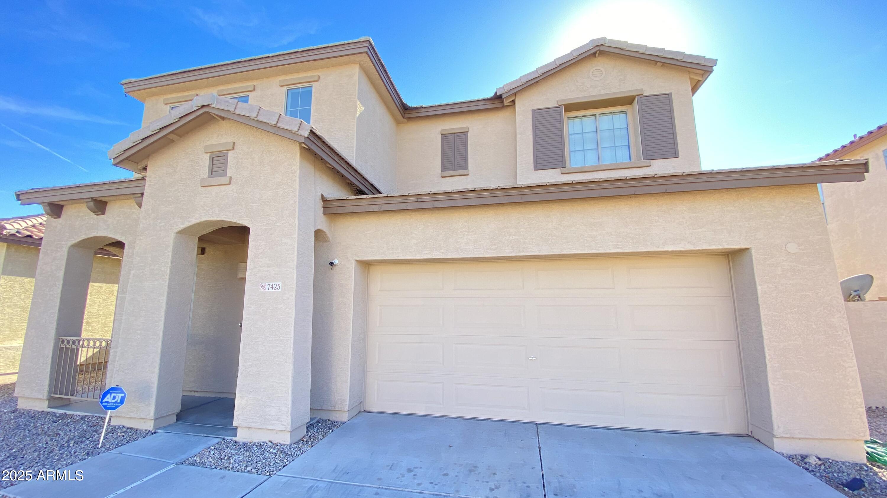 7425 West Crown King Road Phoenix, AZ 85043 - Photo 1 of 27 a view of a house with door