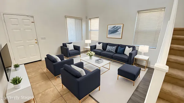 a living room with furniture and a window