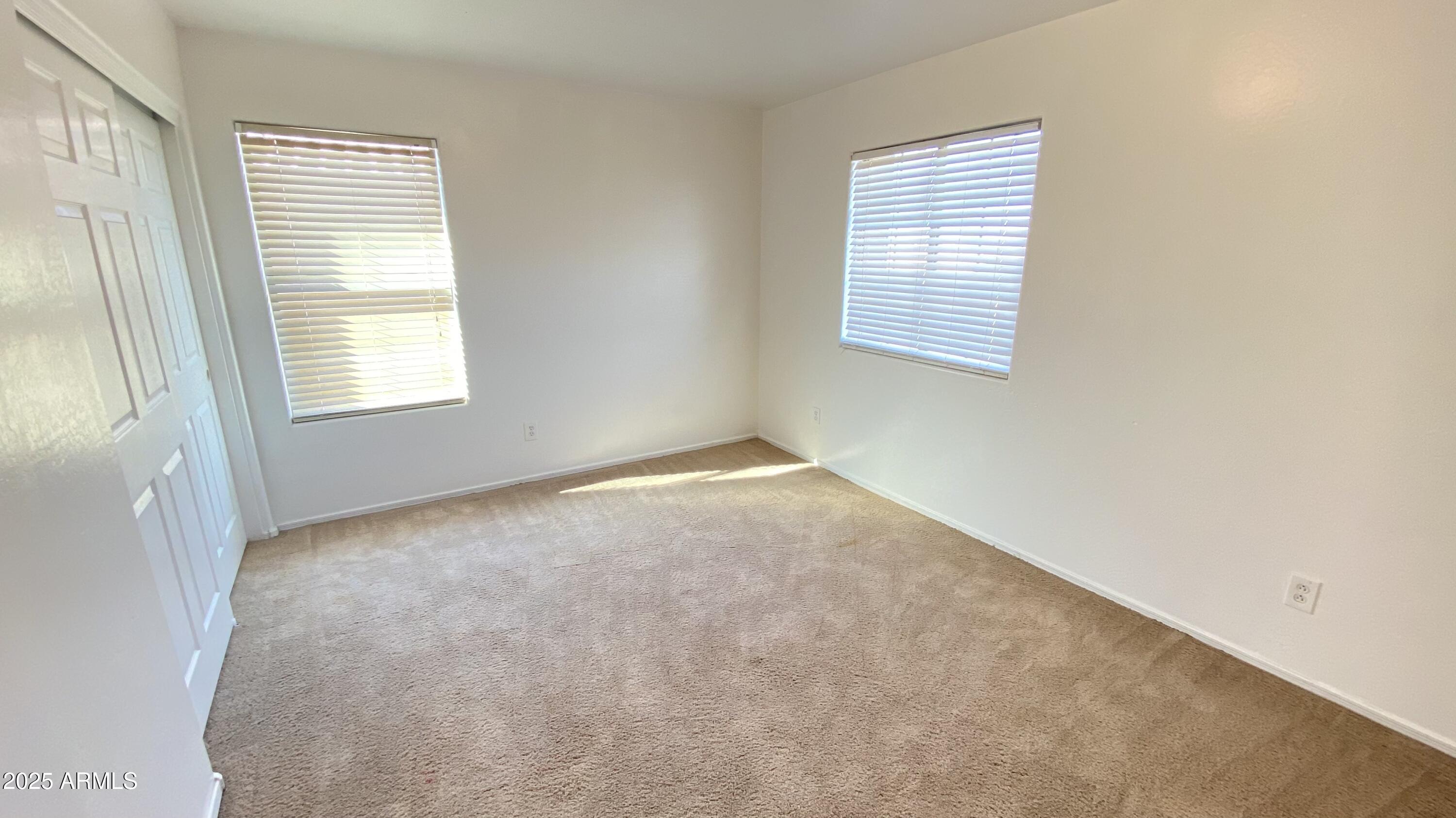 7425 West Crown King Road Phoenix, AZ 85043 - Photo 19 of 27 an empty room with windows