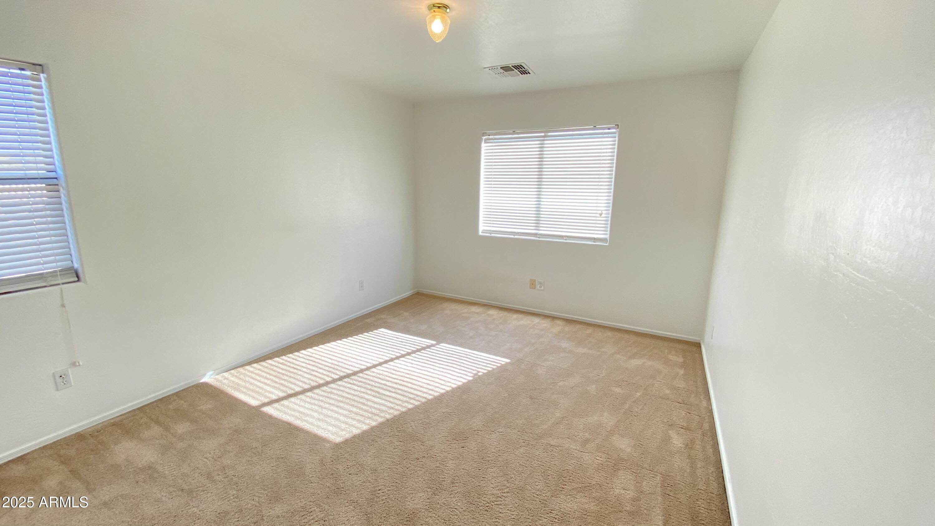 7425 West Crown King Road Phoenix, AZ 85043 - Photo 23 of 27 an empty room with windows